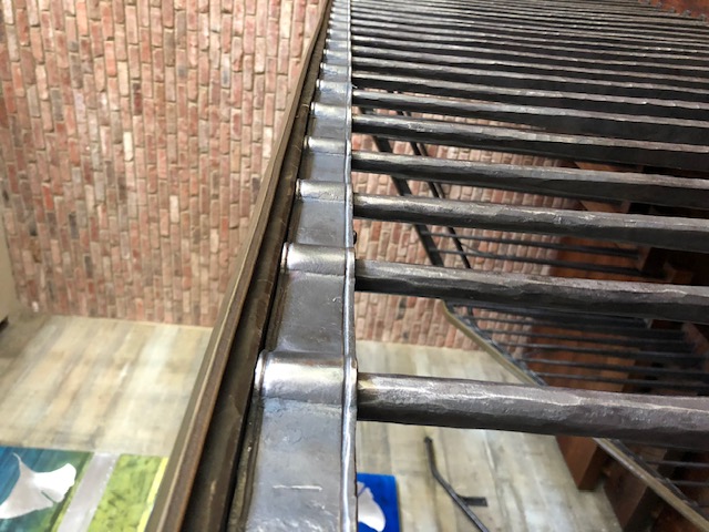 Hand-forged hammered stair railing